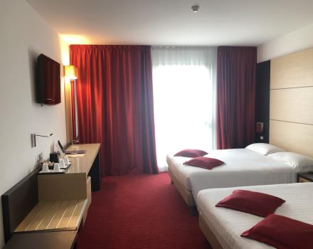 Book The quadruple Room of the BW Plus Hotel Galileo for a comfortable stay in Padua